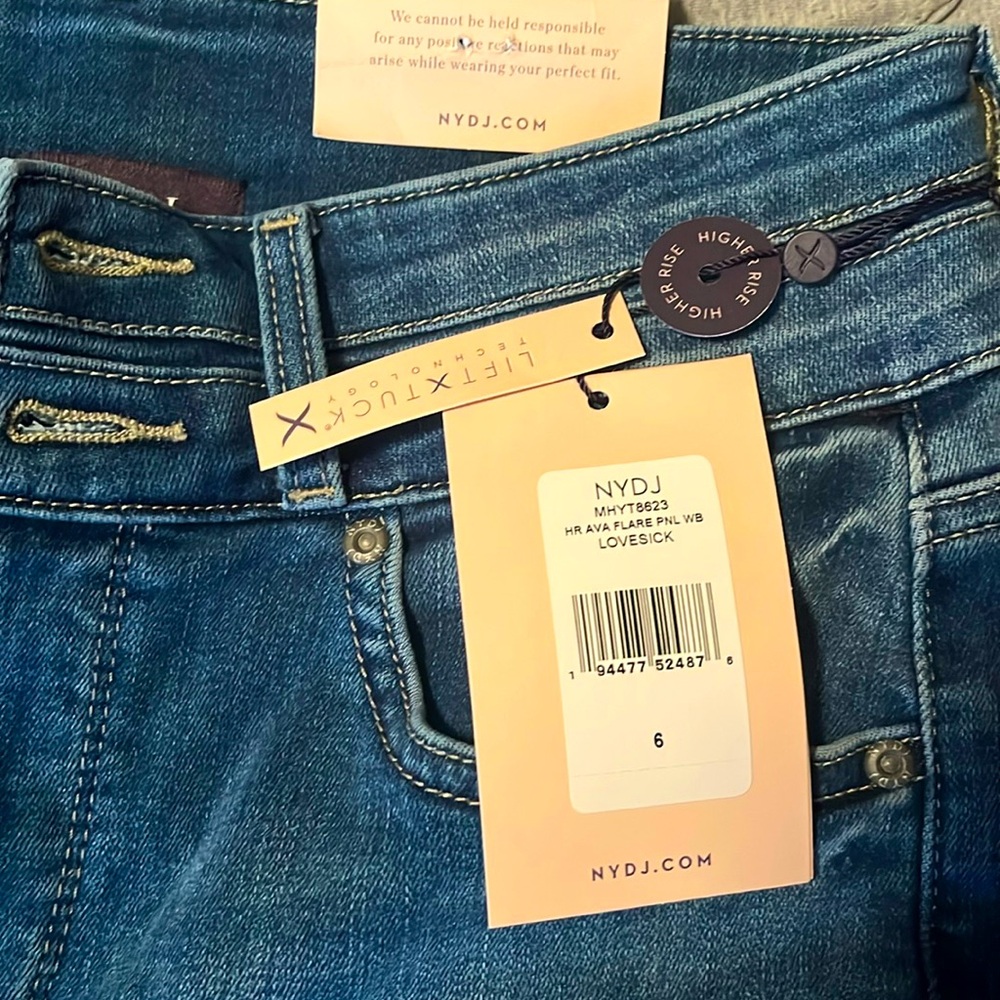 NYDJ FLARE JEANS. 
Size 6. 
Double front buttons. 
Lift X Tuck Technology.